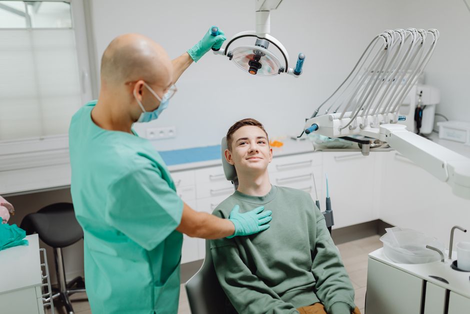 Dentist monitoring pay-per-click advertising performance to boost online visibility and attract local patients.